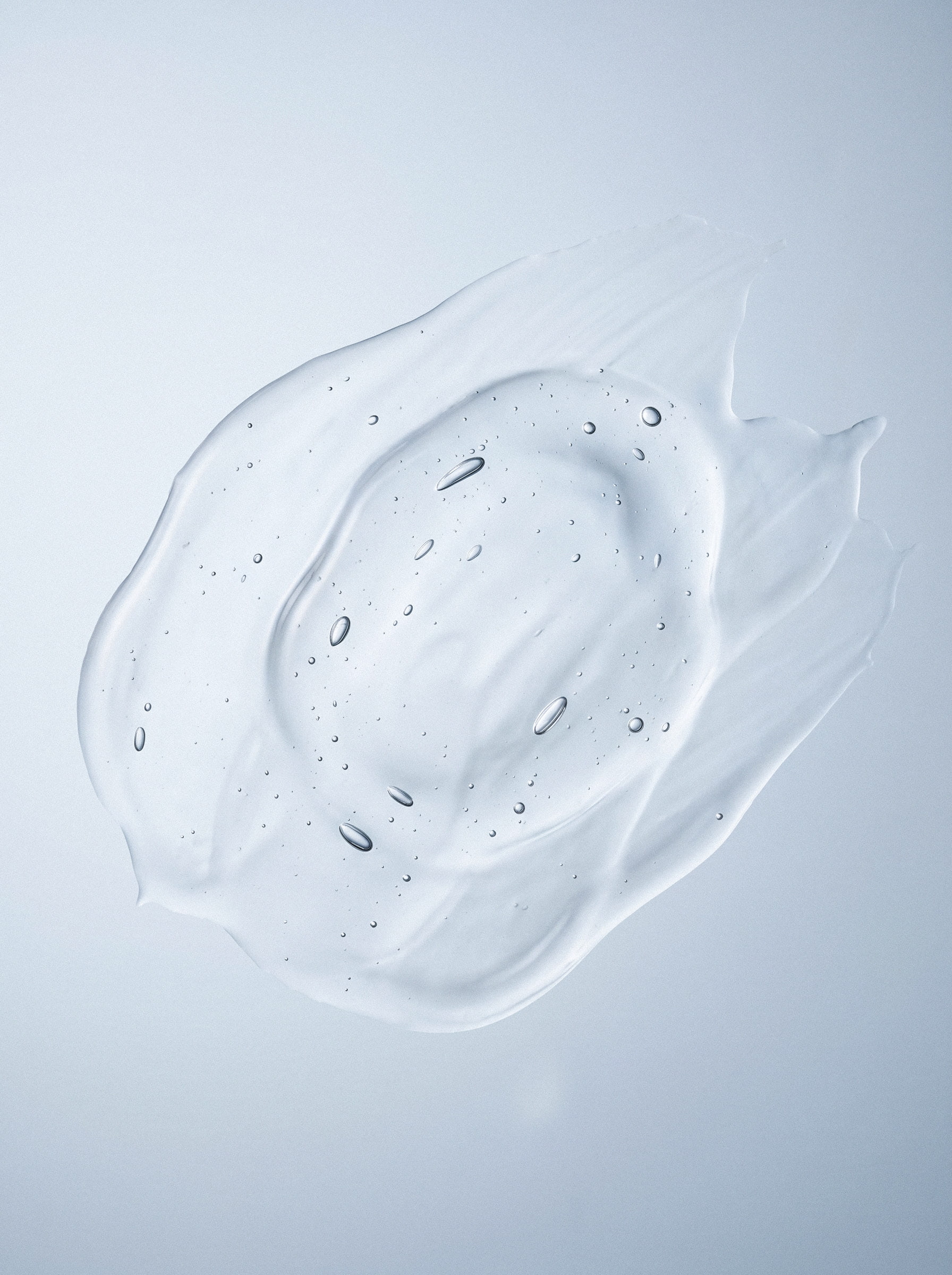 E-commerce web store layout and product description imagery showcasing a clear liquid gel serum texture swatch with air bubbles