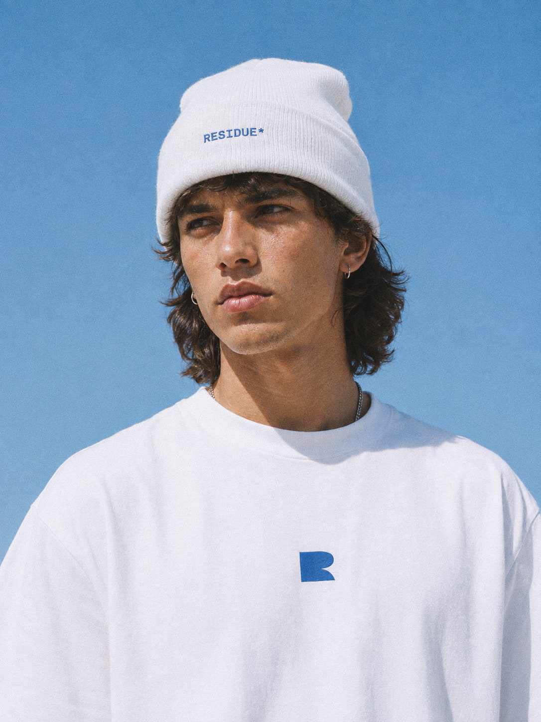 Brand identity and premium merchandise design showcasing lifestyle unisex apparel and graphic merch for Residue beauty brand