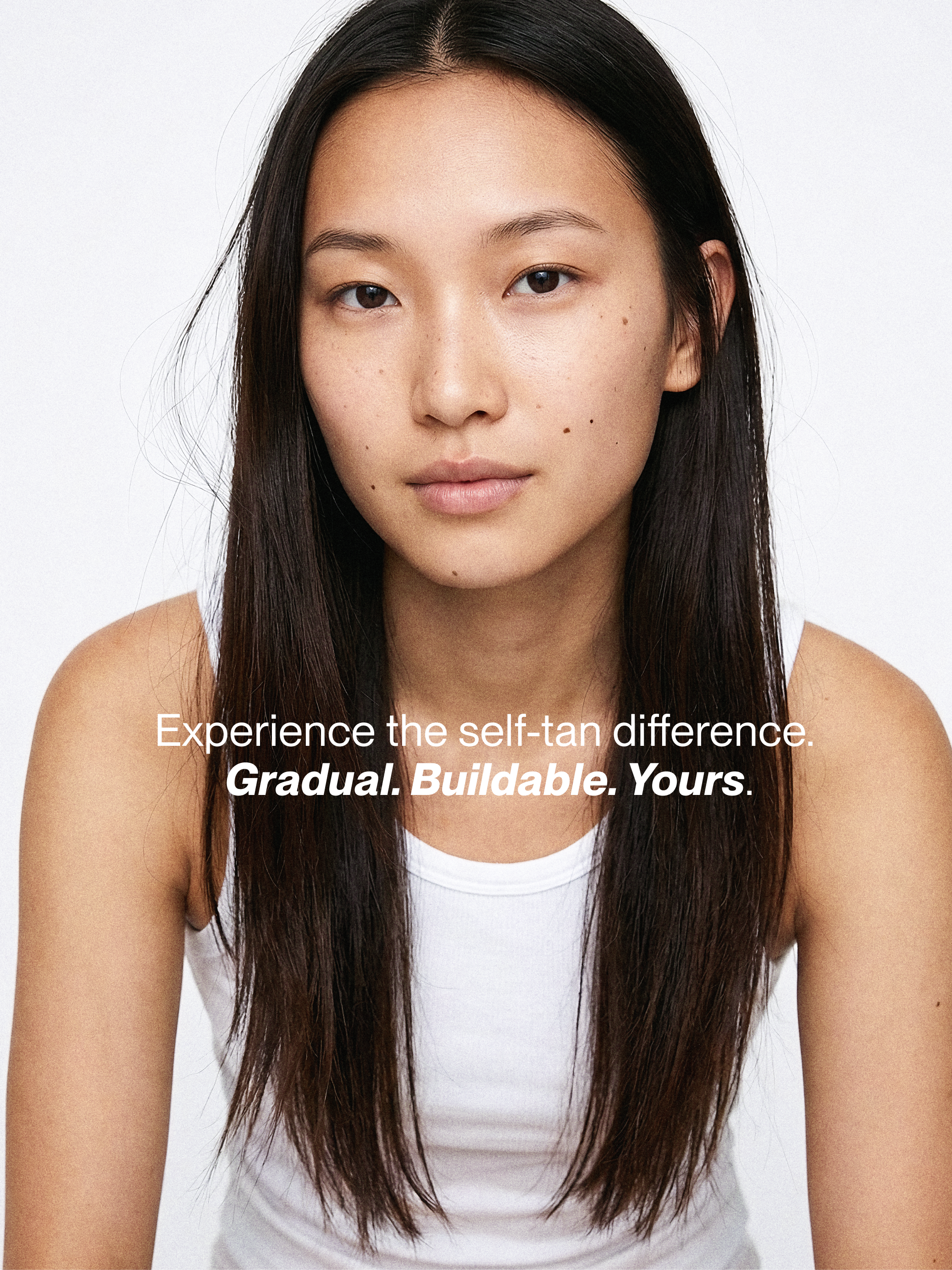 Premium beauty campaign photography and brand identity design showcasing a female model with clean modern typography for a self-tanning line